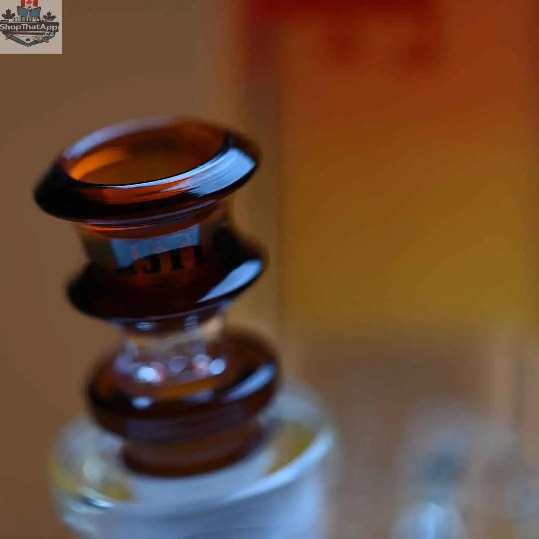 Castle Glassworks 16-inch Samurai Beaker Bong with amber background, featuring thick 9mm glass and a close-up view of the bowl.