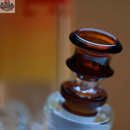 Castle Glassworks 16-inch Samurai beaker bong with amber background, showcasing thick 9mm glass and a close-up of the bowl.