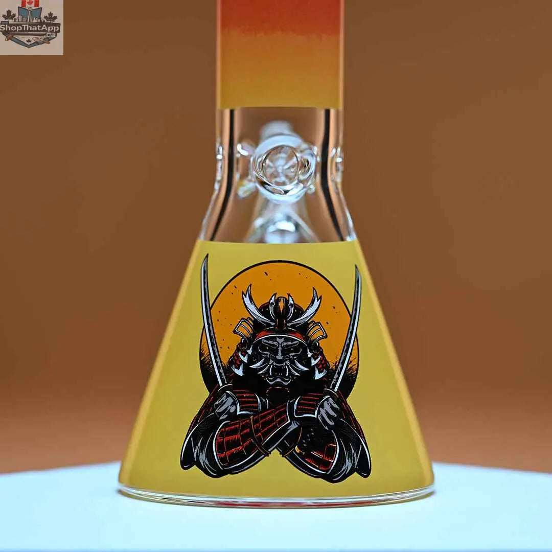 Castle Glassworks 16-inch Samurai beaker bong with amber background, featuring 9mm thick glass for smooth hits.