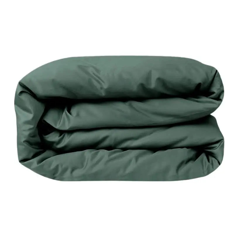 Luxurious forest green sateen duvet cover by Skylark+Owl Canada, featuring smooth, refined fabric for elegant bedroom decor.