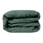 Luxurious forest green sateen duvet cover by Skylark+Owl Canada, featuring smooth, refined fabric for elegant bedroom decor.