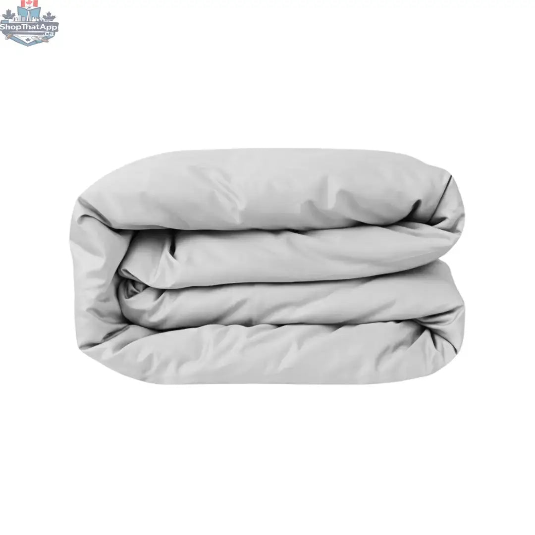 Light grey Skylark+Owl Canada sateen duvet cover showing smooth fabric and elegant bedroom style.
