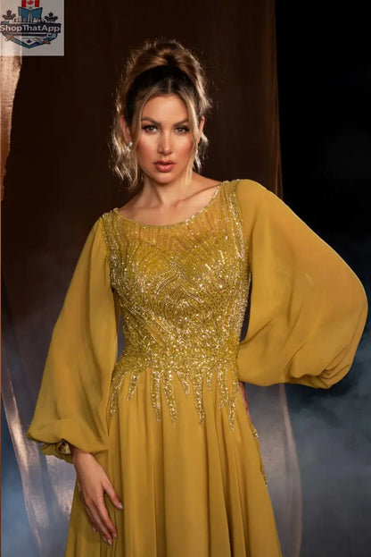 Elegant Threads long evening gown with balloon sleeves and intricate beaded detailing, showcasing a sophisticated and stylish design.