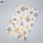 Printed Shy Dragonfly kitchen tea towels by Hem And Tassel, folded flat, featuring dragonfly design in grey and buff colors.