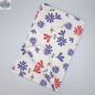 Printed purple and pink Shy Dragonfly tea towel from Hem And Tassel, folded to show the intricate dragonfly design.