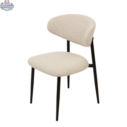Hygge Design House Remi dining chair with wooden legs and cushioned seat, shown in a modern dining room setting.
