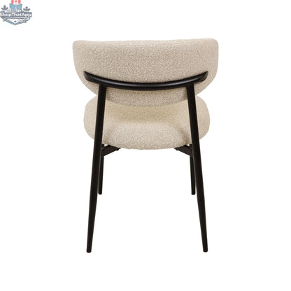 Remi dining chair by Hygge Design House with wooden legs and upholstered gray fabric seat and back for modern dining rooms.