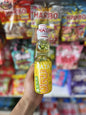 Pineapple flavored HATA Ramune soda in a 200ml Japanese glass bottle with colorful label by Snack Bar Co.