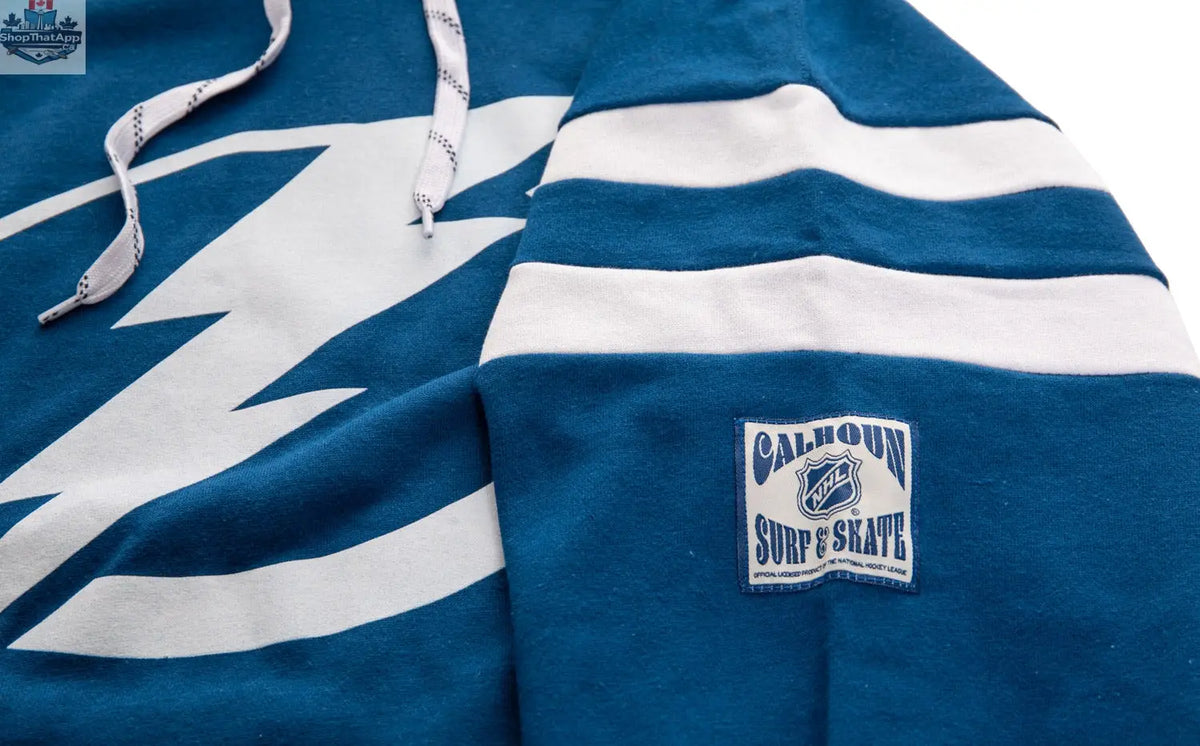 Calhoun Surf N' Skate Tampa Bay Lightning varsity retro hoodie with team logo and bold color design for fans.