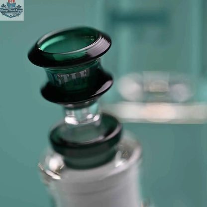 Castle Glassworks 14-inch beaker bong with teal logo, 9mm thickness, colorful base, and a 9-hole downstem replacement.