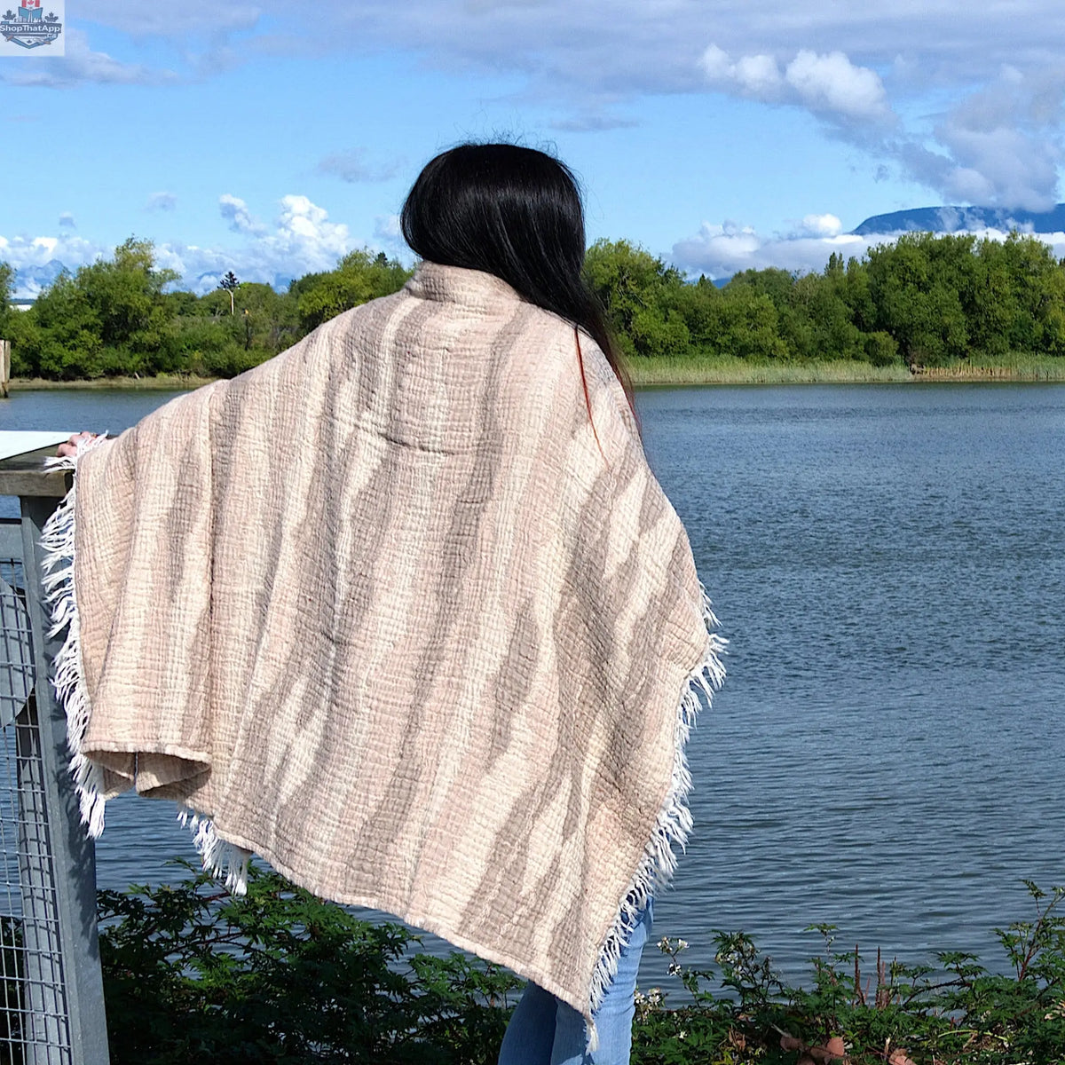 Hem And Tassel cotton throw with wave pattern in beige, showcasing soft, lightweight cotton fabric and fringed edges.