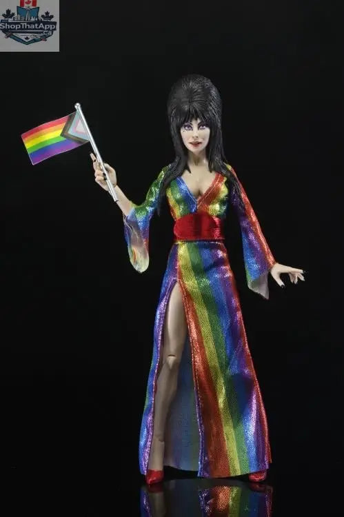 Elvira Mistress of the Dark collectible figure by Toy Snowman, dressed in vibrant rainbow-themed clothing, posed as a detailed action figure.