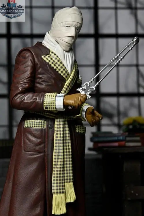 Invisible Man action figure from Toy Snowman's Universal Monsters collection, featuring detailed color design and collectible pose.