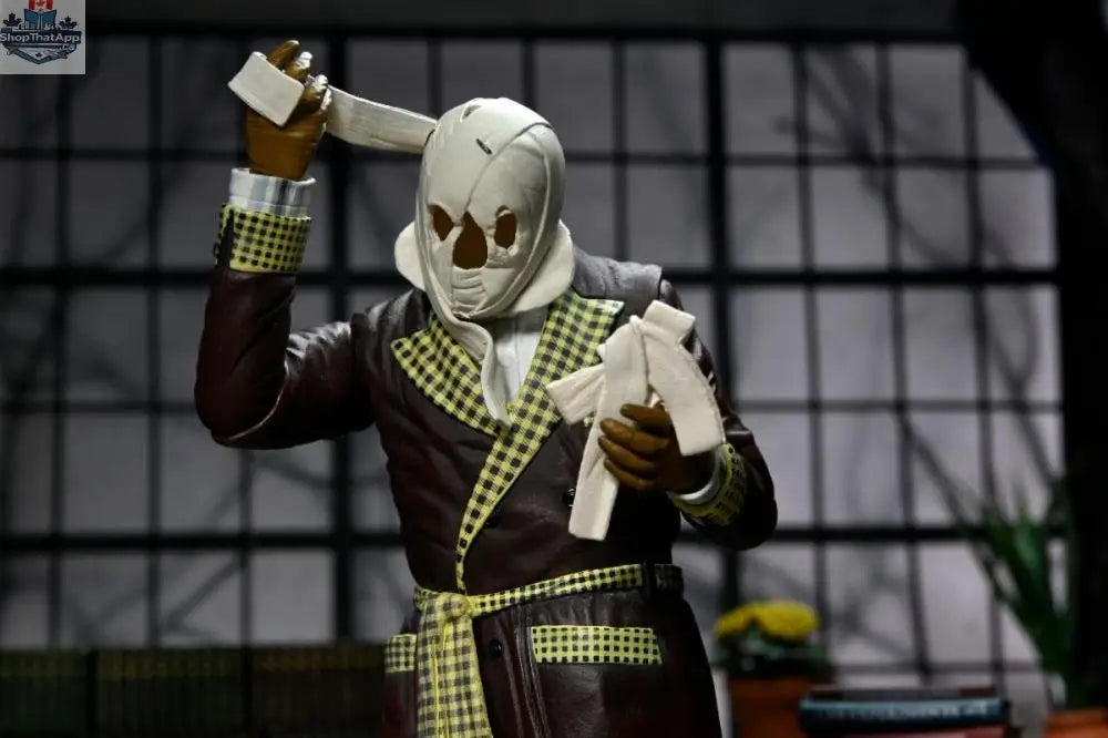 Toy Snowman Universal Monsters Invisible Man collectible action figure, Ultimate Kemp House color version, detailed toy for display or play.