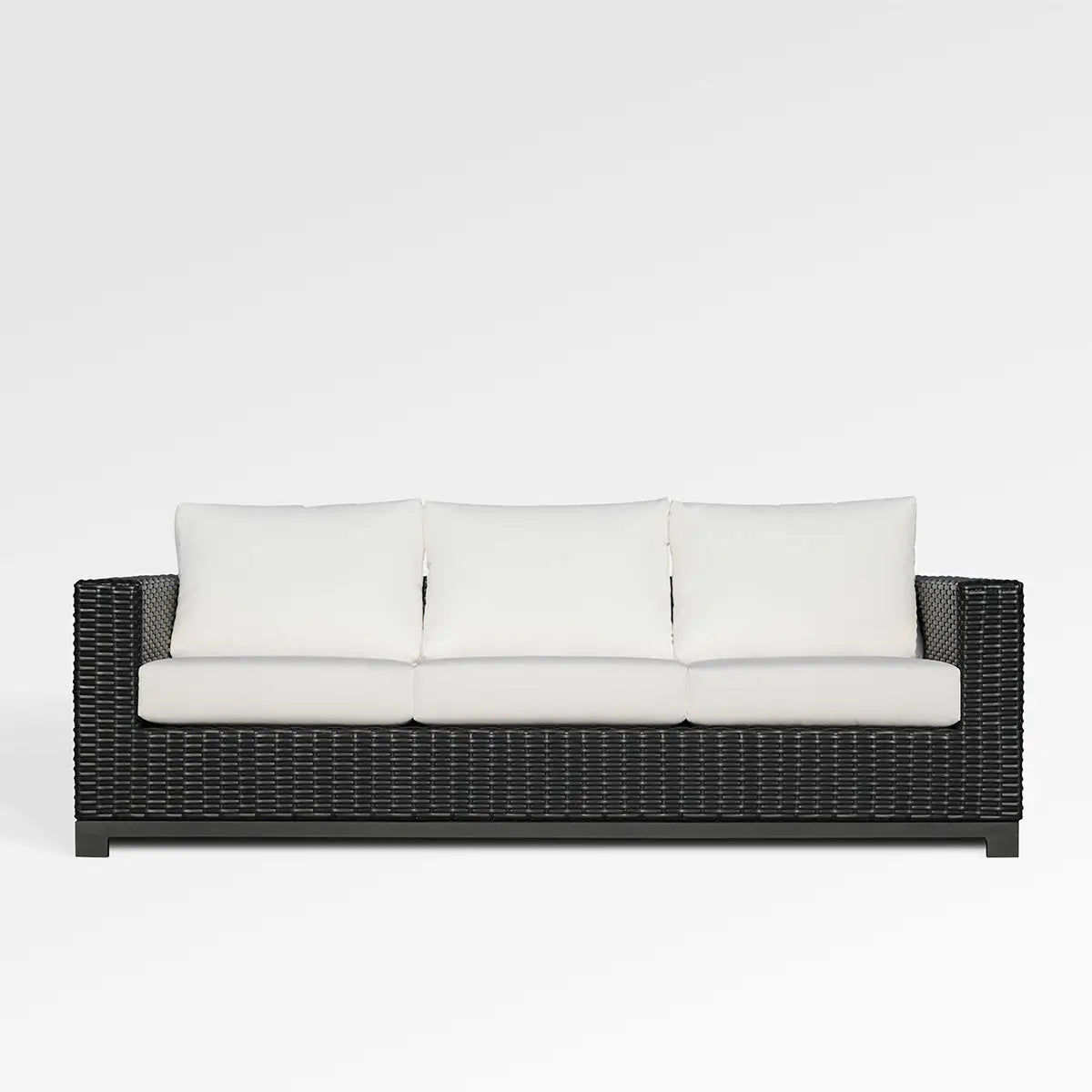 Enclover Trillium sofa with Sunbrella cushions, showcasing a stylish and comfortable living room seating option.