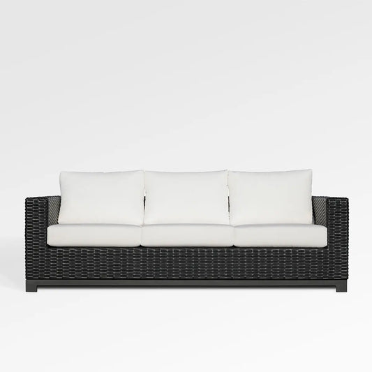 Enclover Trillium sofa with Sunbrella cushions, showcasing a stylish and comfortable living room seating option.