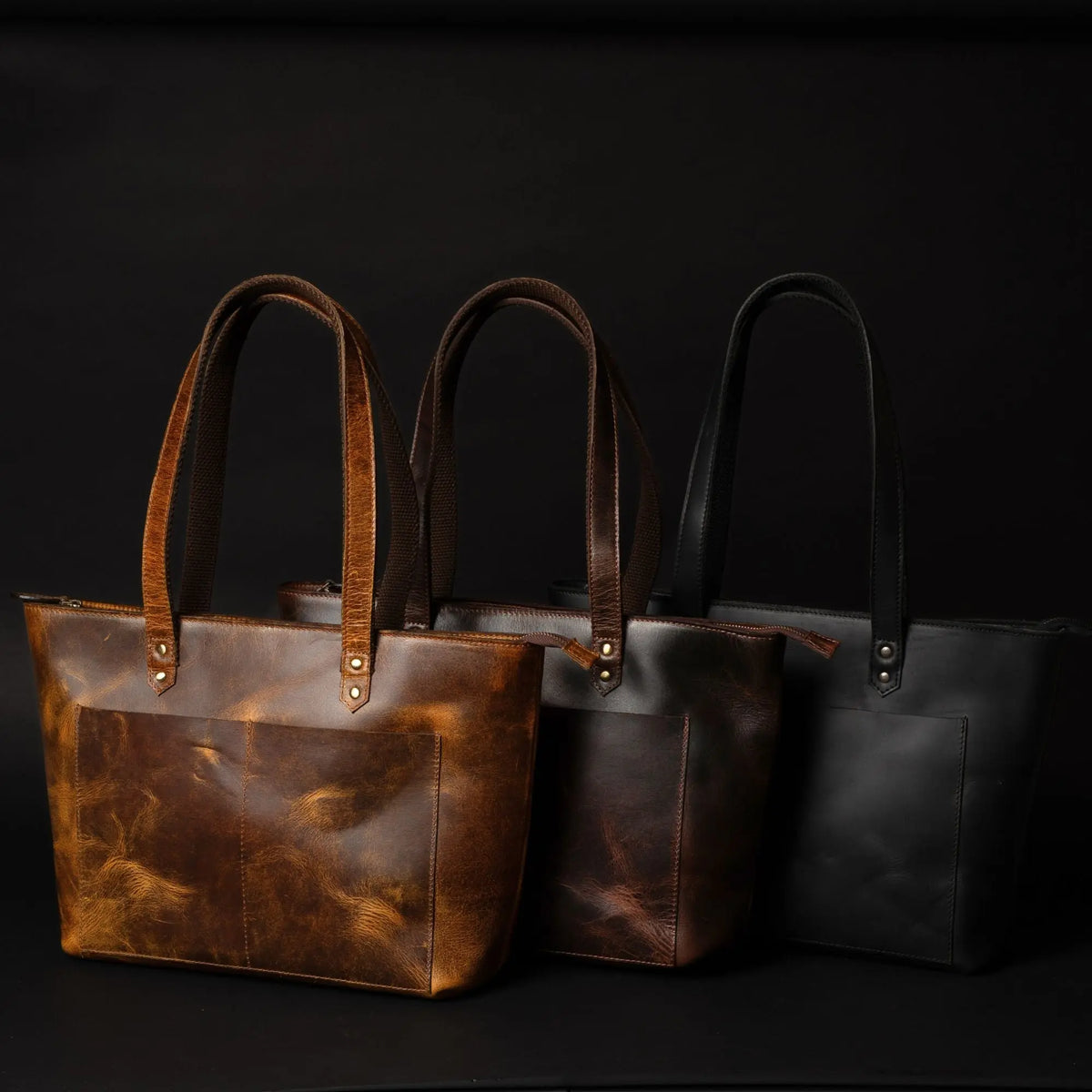Black leather tote bag by NAB Leather featuring sleek design and sturdy handles, perfect for everyday use.