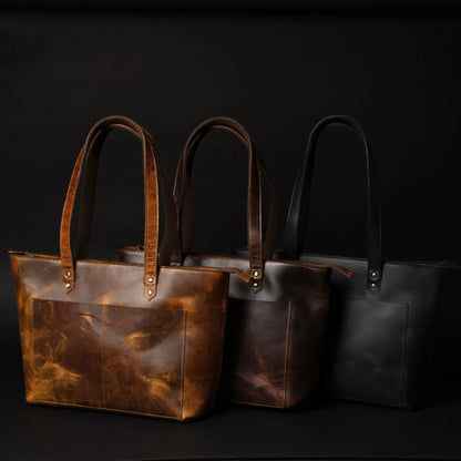 Black leather tote bag by NAB Leather featuring sleek design and sturdy handles, perfect for everyday use.
