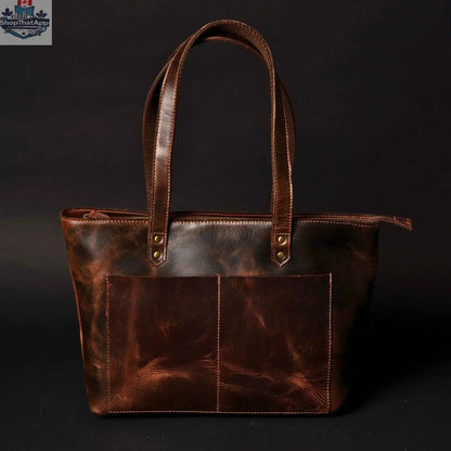 Black leather tote bag by NAB Leather with sturdy handles and sleek design, perfect for everyday use.