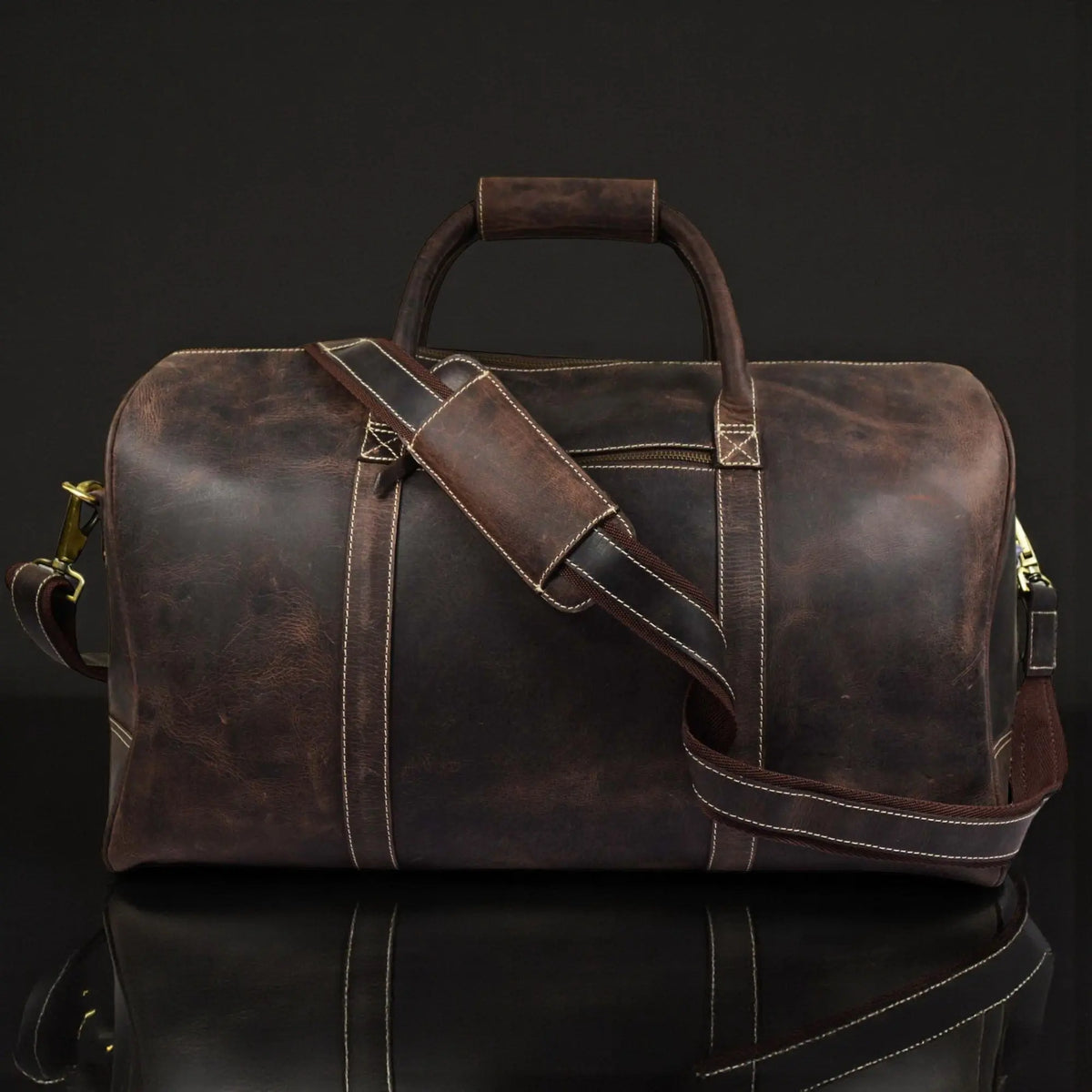 Brown leather duffle bag from NAB Leather's Wayfarer collection, featuring classic full-grain leather and sturdy handles.