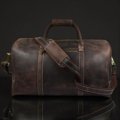 Brown leather duffle bag from NAB Leather's Wayfarer collection, featuring classic full-grain leather and sturdy handles.