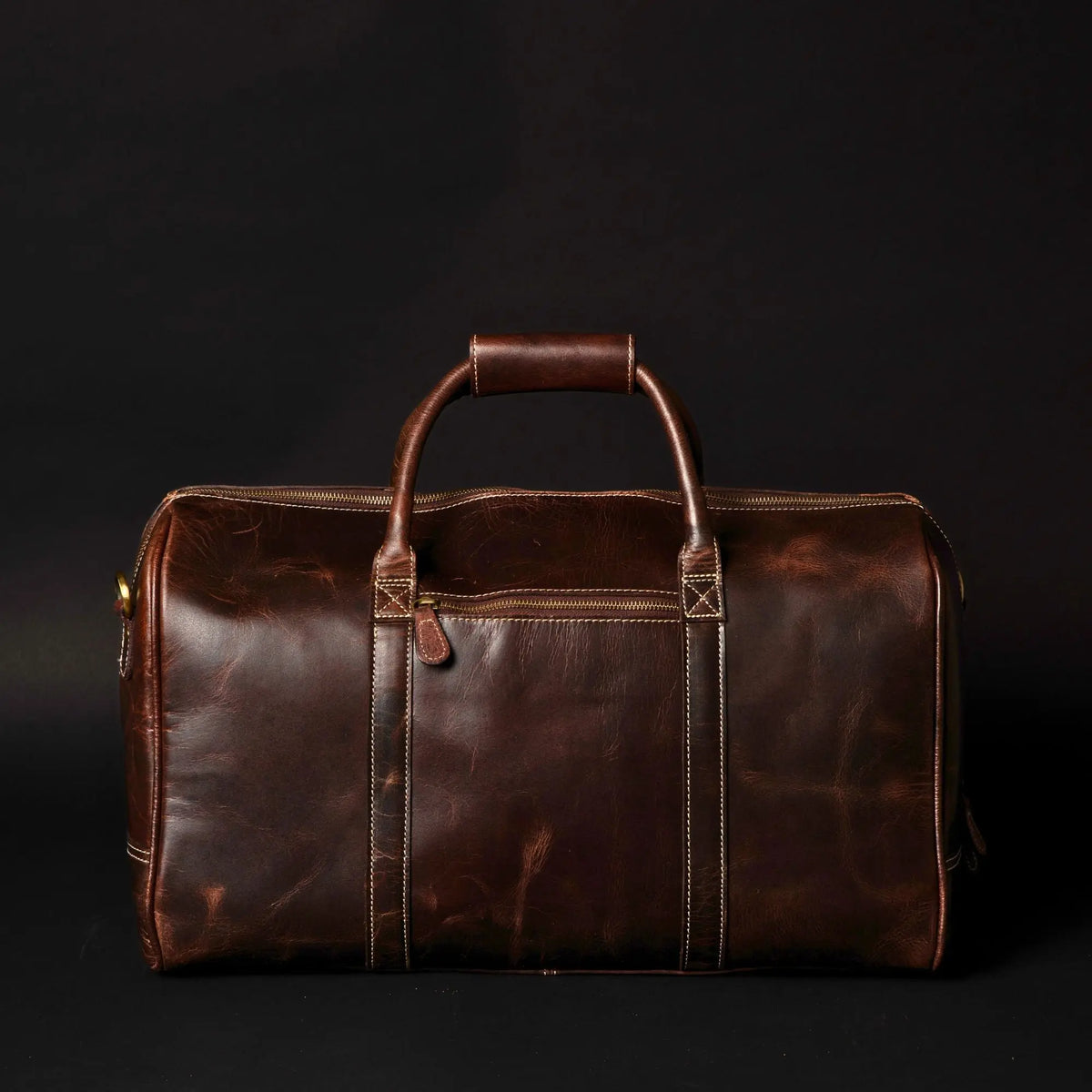 Brown leather duffle bag from NAB Leather's Wayfarer collection, classic full-grain leather with sturdy handles and spacious interior.