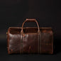 Brown leather duffle bag from NAB Leather's Wayfarer collection, classic full-grain leather with sturdy handles and spacious interior.