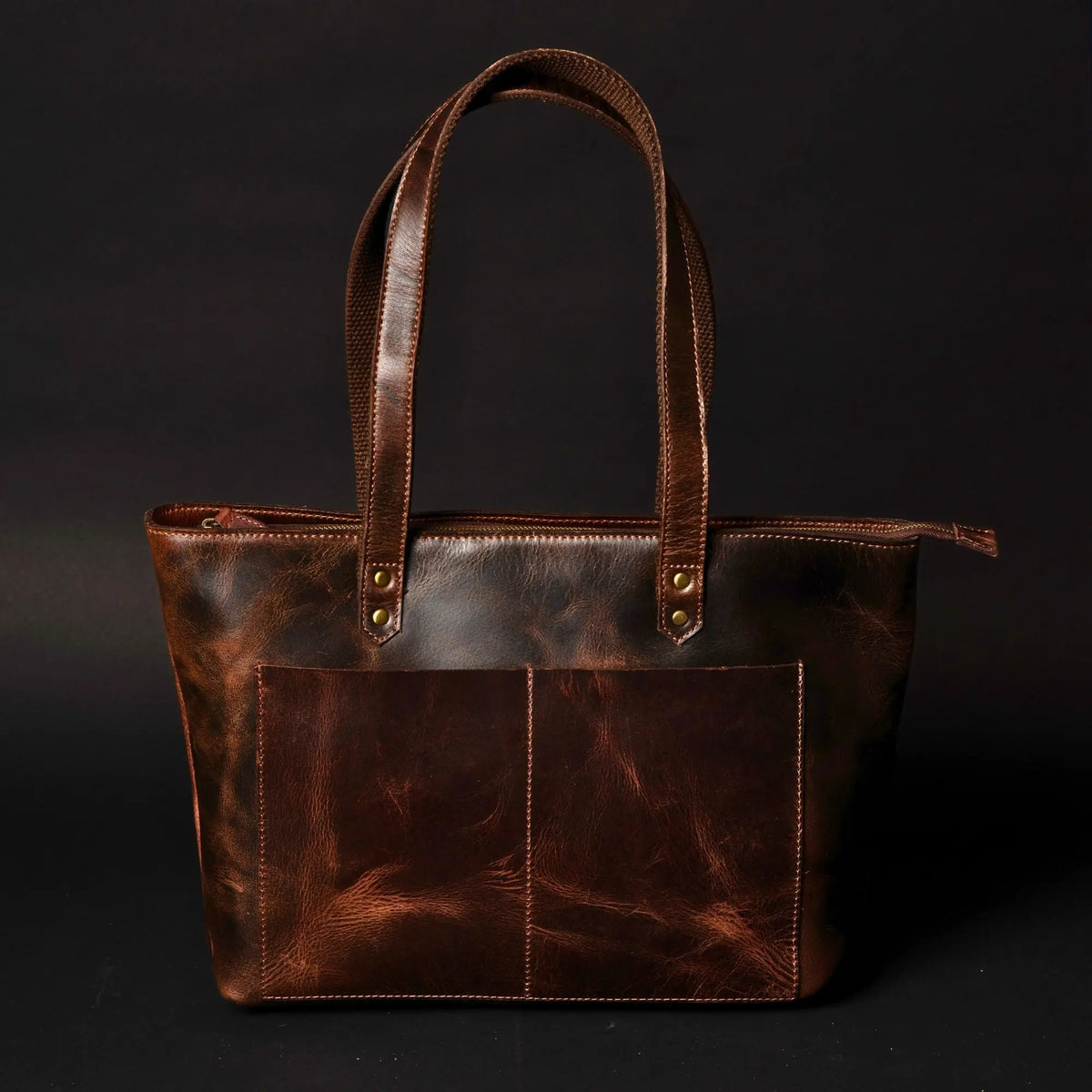 NAB Leather classic brown leather tote bag with sturdy handles and spacious interior, perfect for everyday use and versatile style.