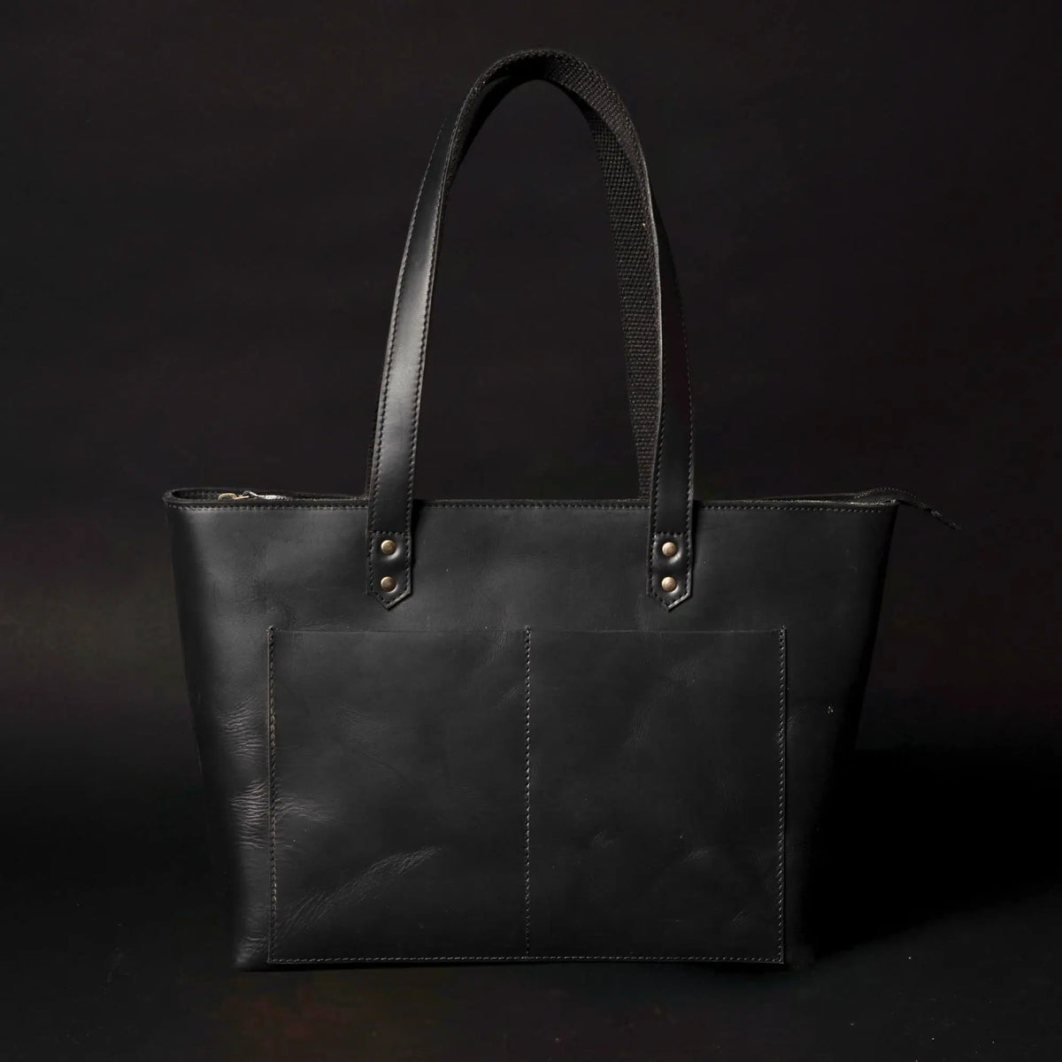Classic black leather tote bag by NAB Leather with sturdy handles and sleek design, perfect for everyday use.