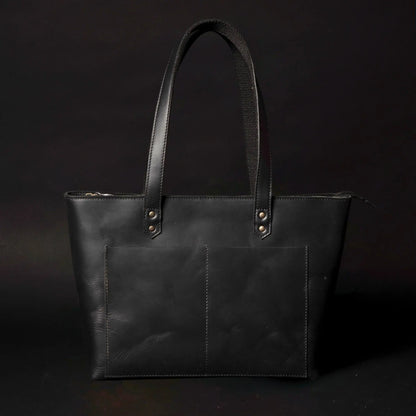 Classic black leather tote bag by NAB Leather with sturdy handles and sleek design, perfect for everyday use.
