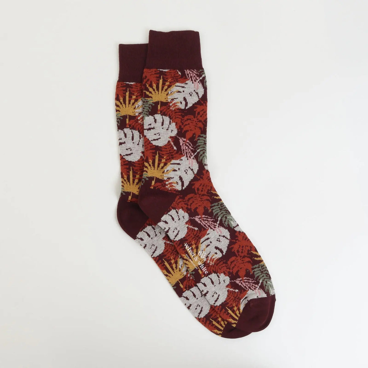 Velvet and White Merlot Floral Wallpaper sock with elegant floral pattern, showcasing vibrant merlot-colored flowers on fabric.
