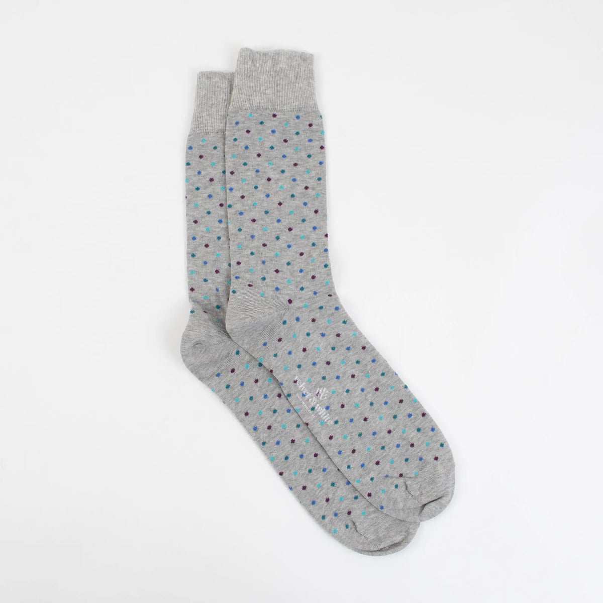 Grey Matter Dots socks by Velvet and White featuring a grey background with white dot pattern. Comfortable casual sock design.