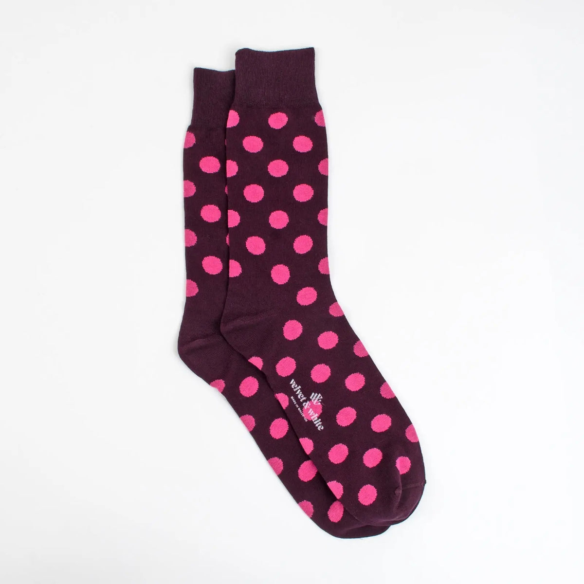 Pink polka dot fabric from Velvet and White, ideal for crafting and sewing projects, shown in a close-up image.