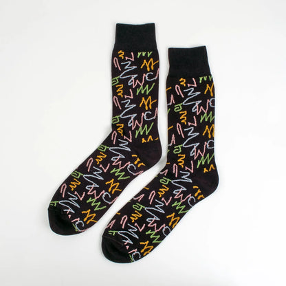Velvet and White zig zag patterned socks with trendy, colorful design for a unique style, displayed on a neutral background.