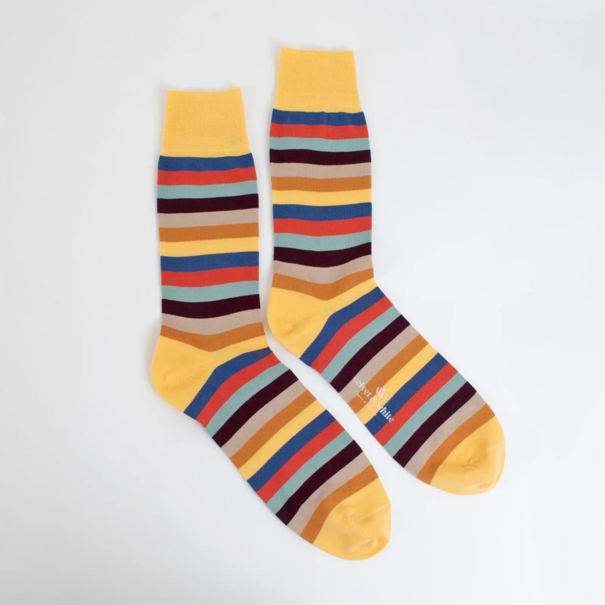 Pair of Velvet and White Candy Stripes socks with colorful striped pattern, comfortable knit fabric, perfect for casual wear.