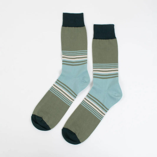 Green striped socks made from premium fabric by Velvet and White, featuring stylish green and white stripe pattern.