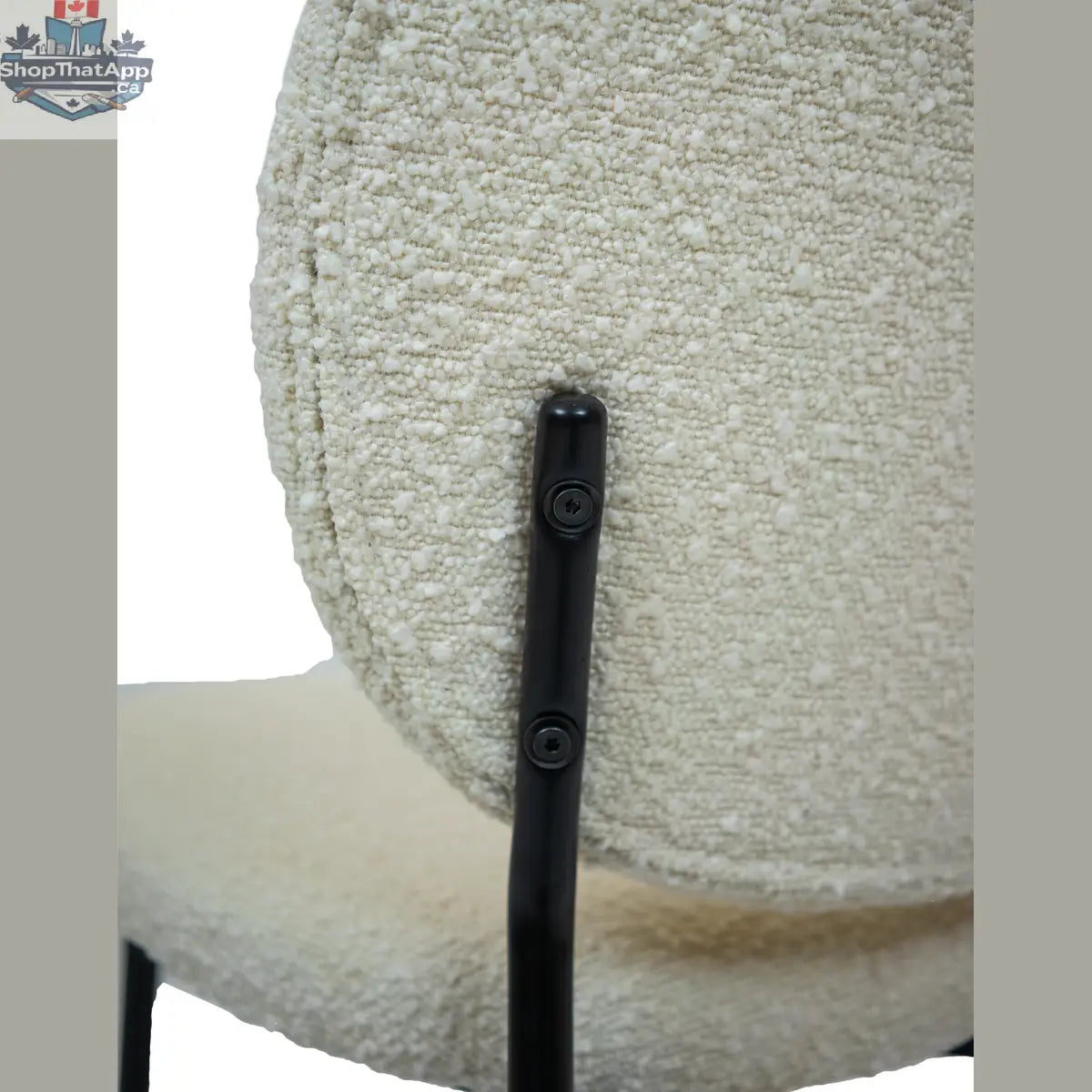 Hygge Design House Sashi Linen Boucle Dining Chair with wooden legs, modern Scandinavian style, close-up view of upholstered seat