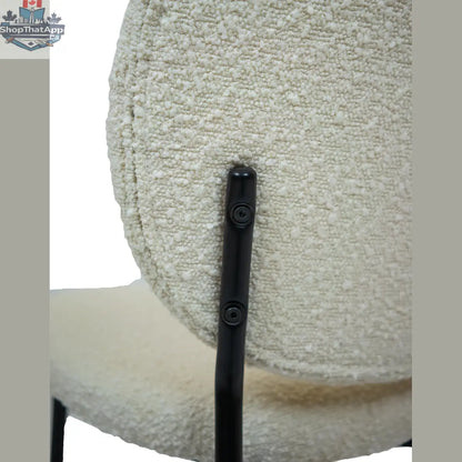 Hygge Design House Sashi Linen Boucle Dining Chair with wooden legs, modern Scandinavian style, close-up view of upholstered seat