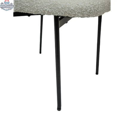Hygge Design House Sashi Linen Boucle Dining Chair with sleek wooden legs and modern, textured upholstery.