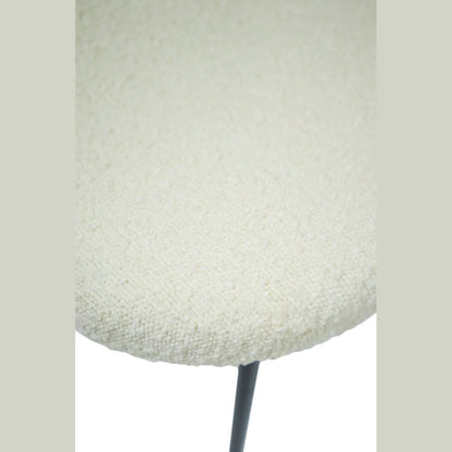 Hygge Design House Sashi Linen Boucle Dining Chair with modern wooden legs and plush upholstered seat.