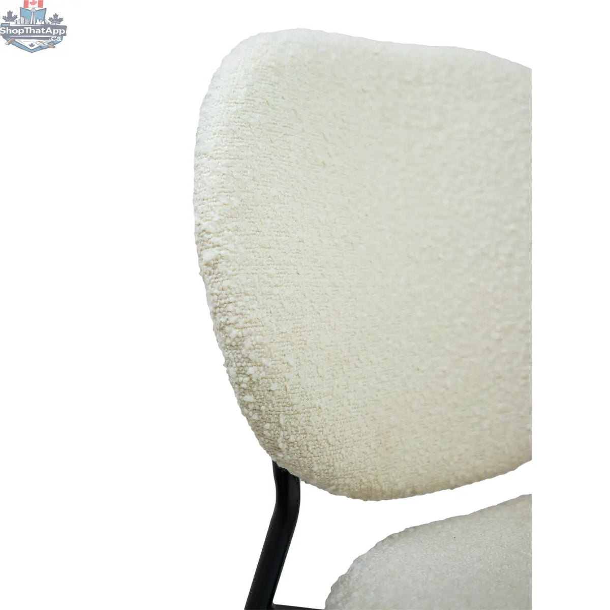 Hygge Design House Sashi dining chair with linen boucle upholstery, modern design, and wooden legs.