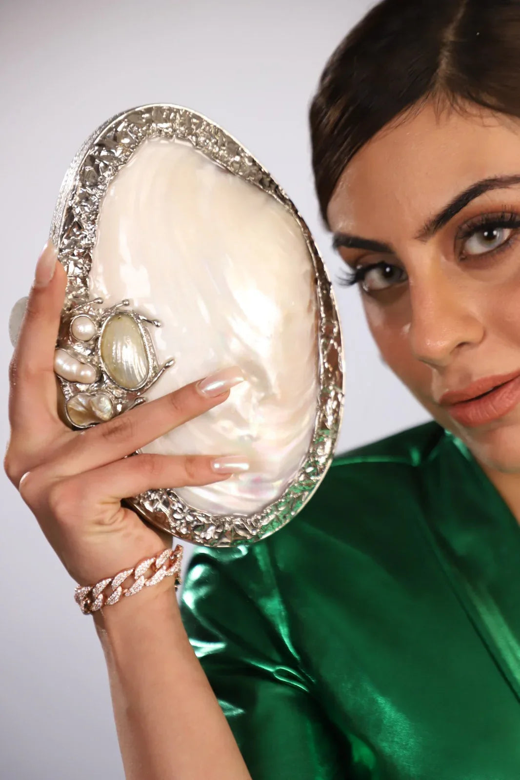 Elevate Your Style with Our Luxurious Silver Shell Clutch
