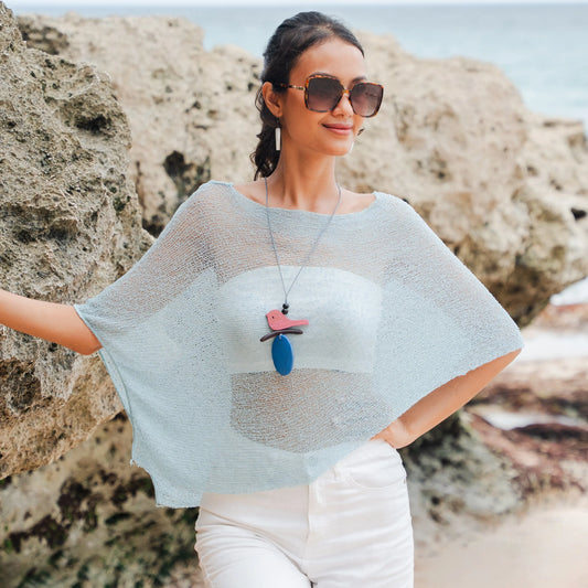 Mint sheer mesh poncho by Suzie Blue Canada, stylish knitwear cover-up featuring breathable, lightweight fabric for versatile wear.