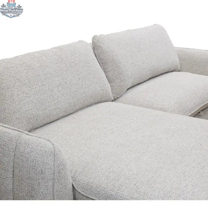 Amira pullout sleeper sectional with storage chaise by Hygge Design House, featuring stitched armrests and modern fabric upholstery.