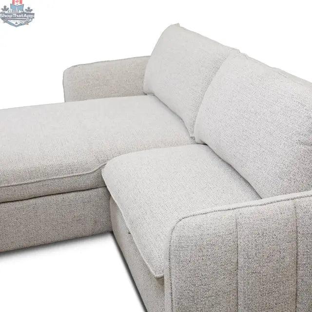 Amira pullout sleeper sectional with storage chaise from Hygge Design House, showing detailed joint and fabric upholstery.