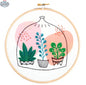 Hawthorn Handmade Glass Garden embroidery kit by Art Noise showing colorful fabric and embroidery floss for needlecraft.