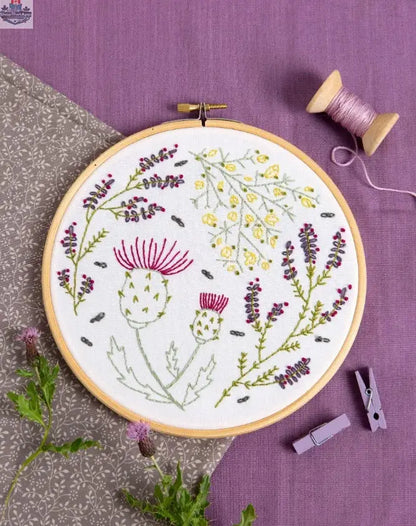 Hawthorn Handmade Highland Heathers embroidery kit by Art Noise featuring colorful needlecraft supplies and fabric for embroidery.