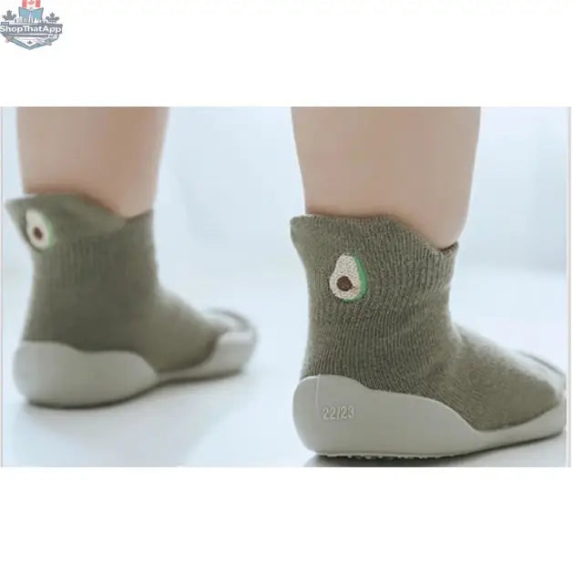 Wild Baby sock shoes for infants showing soft fabric and elastic ankle support, perfect for comfortable baby footwear.