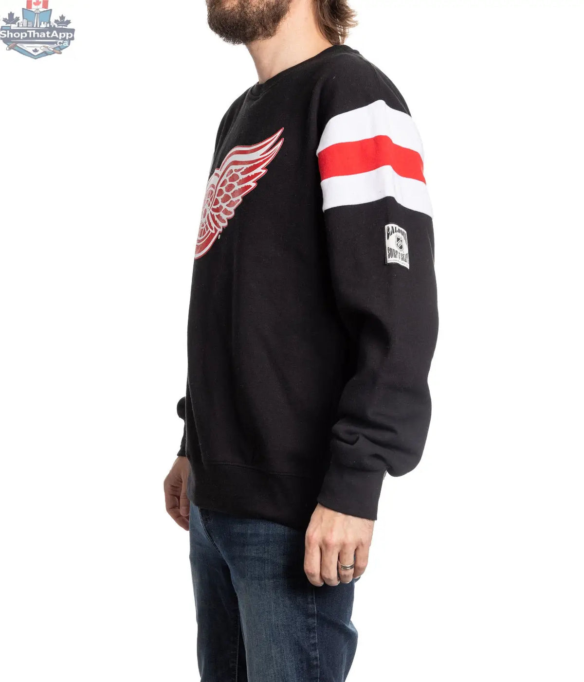 Detroit Red Wings crewneck sweater in retro varsity style, displayed from the side, by Calhoun Surf N' Skate.