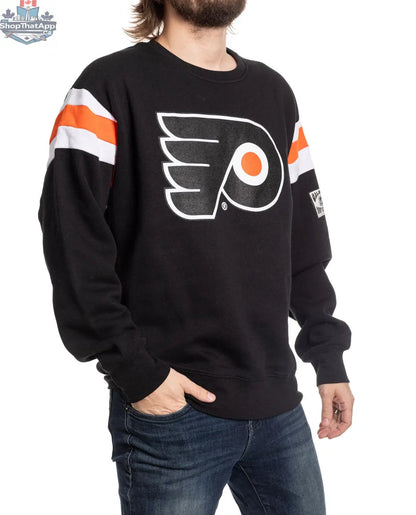 Side view of Calhoun Surf N' Skate Philadelphia Flyers varsity crewneck sweater with retro team logo and ribbed cuffs.
